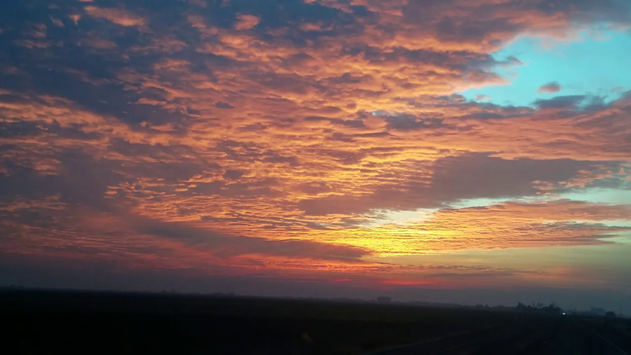 The sun above the clouds is lighting underneath the clouds