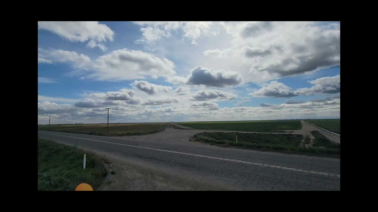 Clouds are slanting down because of perspective...not because of curvature
